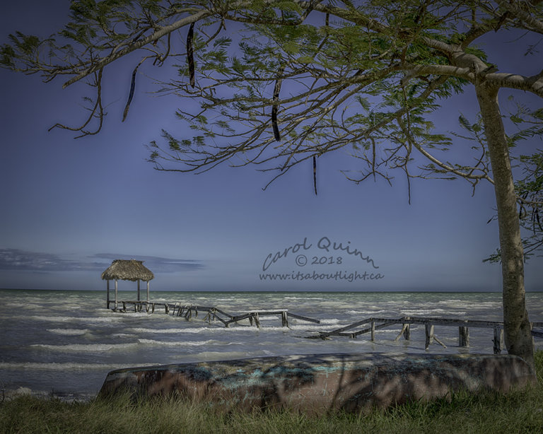 Sarteneja seaside with canoe, by Carol Quinn. ID 2CQ2268-71 rev 1b