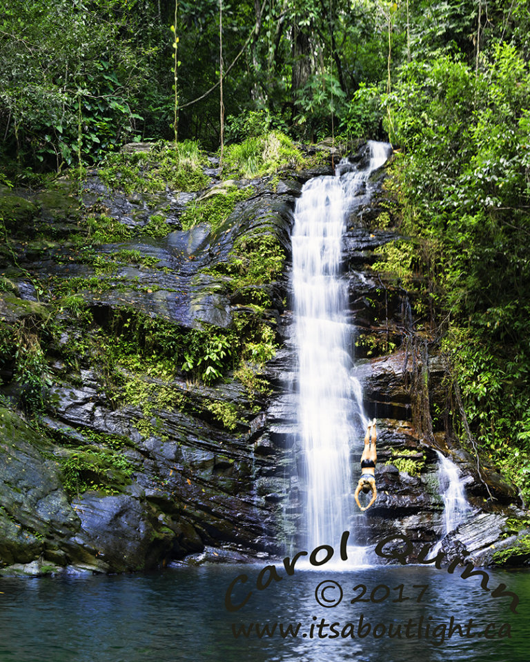 Upper falls with diver, by Carol Quinn. La Milpa is a conservation and research area, and also an Archeological site for Mayan ruins. ID 2CQ0755-62 rev 1c